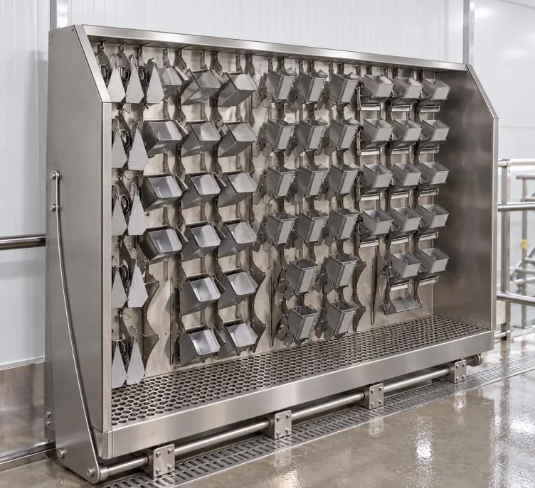 Weigher hoppers arranged on a stainless-steel washing and storage wall